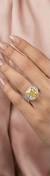 Cushion cut yellow solitaire ring