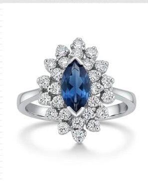 Marquise blue topaz starburst cluster ring