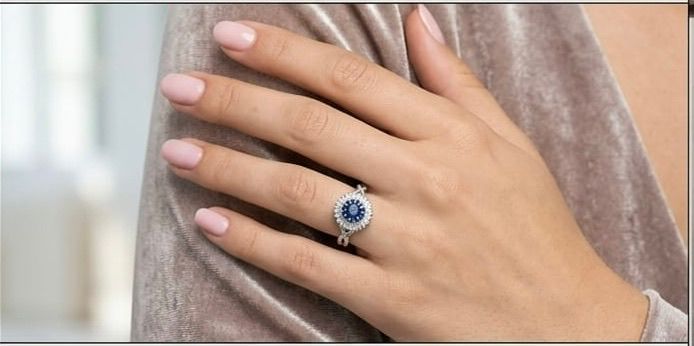 Sapphire sunburst double halo ring