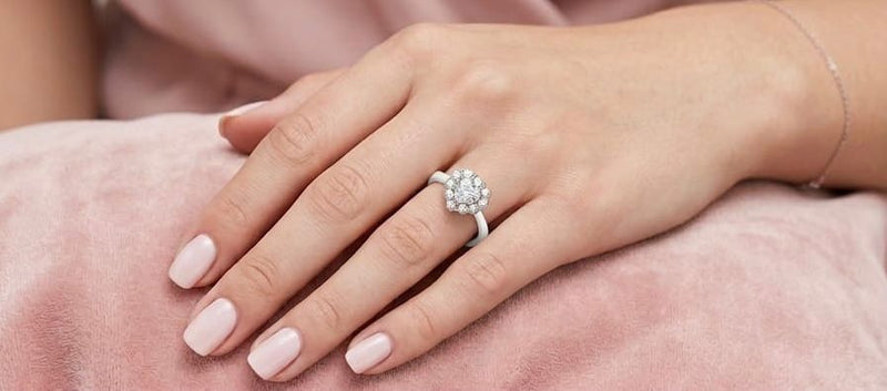 Floral cluster solitaire ring