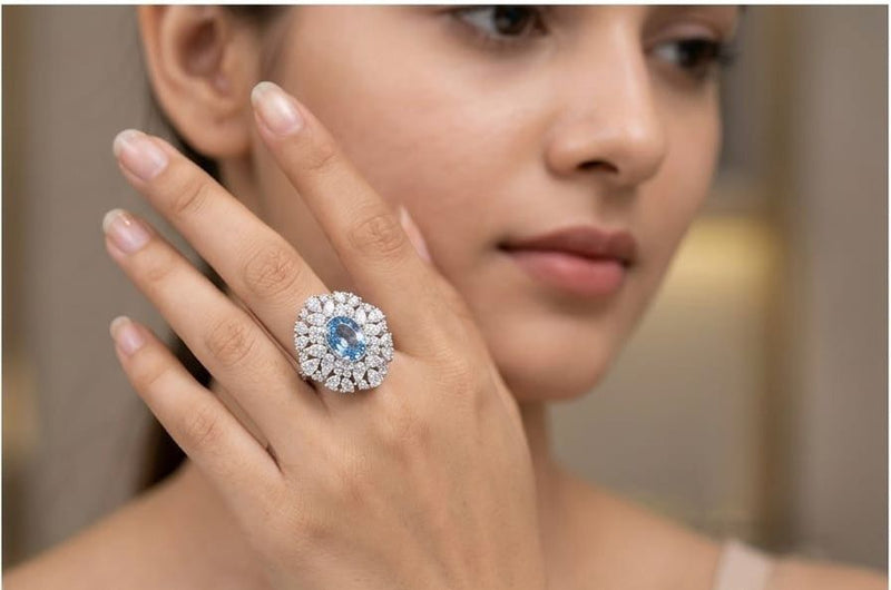 Ice blue solitaire medallion ring
